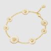 Georg Jensen “Daisy armbånd" i forgylt sølv med 8 hvite emaljerte blomster