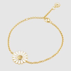 Georg Jensen “Daisy armbånd" i forgylt sølv med hvit emaljert blomst