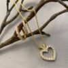 Anheng hjerte i gult gull med diamanter 0,60 ct