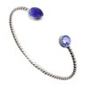 Huldreverket "Tvunnet" armring med Tansanitt og swarovski