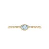 "Aqua" ring i gult gull med topas