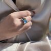Noën "Stellini" large ring i gult gull, med diamanter topas, London blå topas og turmalin