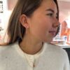 Nora Mørk kjede med rosett anheng i forgylt sølv med mørk oransje c.zirkonia