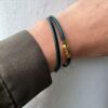 Armbånd fra Heizendorff i grønt skinn. Einersen Gull i Arendal. Gullsmed