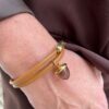 Armbånd fra Heizendorff i gyldne bruntoner. Einersen Gull i Arendal. Gullsmed