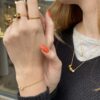 Ulrikke Vogt "Triple Bud Floret" ring i forgylt sølv med onyks og røkkvarts