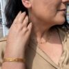 Susanne Friis Bjørner ørepynt i forgylt sølv med fasetterte kuler i grønn agat
