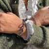 By Birdie "Samsara Golden link" armbånd i sølv med gult gull detaljer