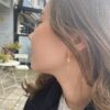 Susanne Friis Bjørner ørepynt i forgylt sølv med beige ferskvannsperle
