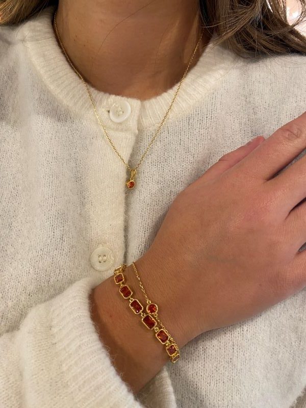 Nora Mørk armbånd med rekangulære ledd med dyporansje c.zirkonia i forgylt sølv