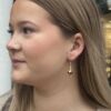 Noën «Dolce» ørepynt heng i forgylt sølv med champagne kvarts