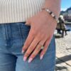 Armbånd og ring fra By Birdie i oksidert sølv med blå toner. I ringen er det sølv og gull med rund akvamarin