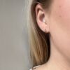 Ørepynt gullkule i 4 mm med enliten c.zirkonia fattet over.
