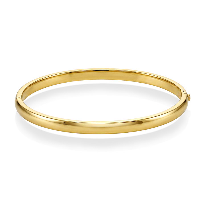 Enkel oval armring i gullfarget stål fra Frida Leonore,
